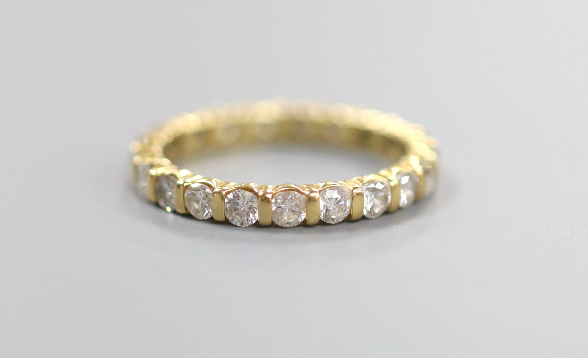 A modern 18ct gold and diamond set full eternity ring, size P, gross weight 3.8 grams.